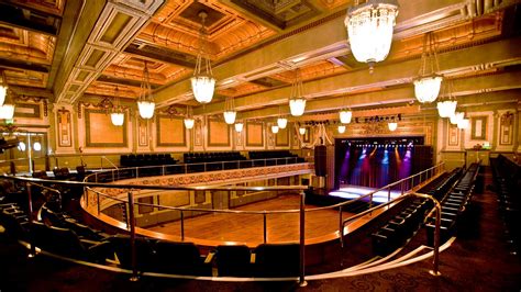The regency ballroom - Established in 1909. This stunning room features blonde hardwood floors, a horseshoe-shaped balcony and a built-in stage. Noted as a fine example of Scottish Rite architecture, which includes neoclassic and beaux arts styles, the Regency Building was built in 1909. The Grand Ballroom is a beaux-art treasure with thirty-five foot ceilings and twenty-two turn-of-the-century teardrop chandeliers. 